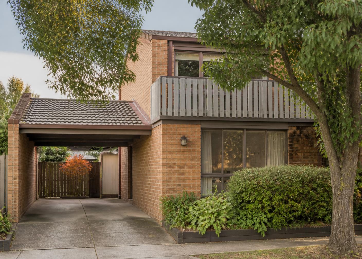 Brick townhouse with carport in a leafy Melbourne suburb